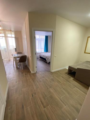 a bedroom with a bed and a desk in a room at Нові апартаменти по вулиці Роксолани16 in Truskavets