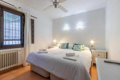 Ένα ή περισσότερα κρεβάτια σε δωμάτιο στο Porta Maris Javea