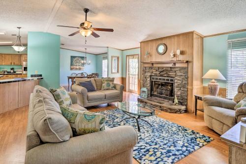 a living room with a couch and a fireplace at Steinhatchee Home with Boat Parking 1 Mi to Marina in Steinhatchee