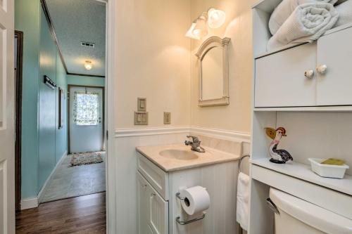 a bathroom with a sink and a mirror at Steinhatchee Home with Boat Parking 1 Mi to Marina in Steinhatchee