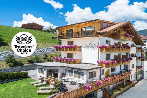 a rendering of a house with flowers on the balcony at Pension Sonnenhof in Maranza