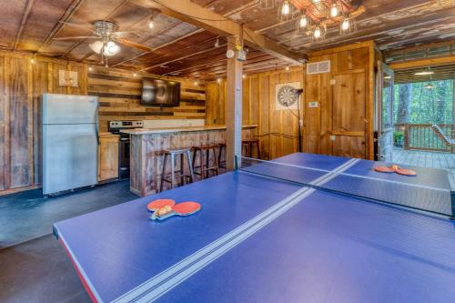 a ping pong table in a room with a kitchen at Secluded Sunrise Ridge-10 Min From Blue Ridge, King Beds, Hot Tub, 2 Porches, Fireplace Wood Burning, Mountain View, Cozy in Blue Ridge