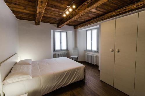 Ένα ή περισσότερα κρεβάτια σε δωμάτιο στο Residence Il Muretto