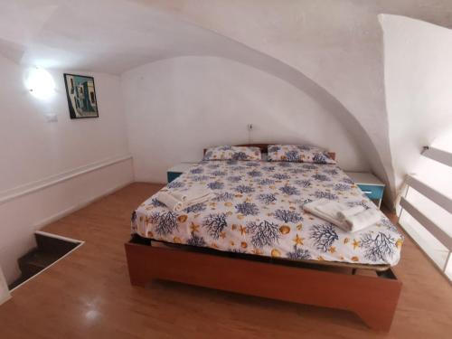 a bedroom with a bed in an attic at La Fontana in Gallipoli