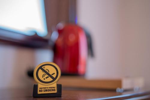 a no smoking sign sitting on a table at Villa Afrodita Lake View in Ohrid