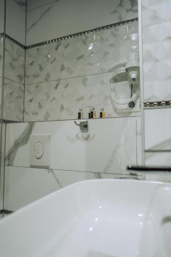a bathroom with a sink and a mirror at Villa Afrodita Lake View in Ohrid