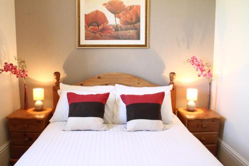 the grange boutique guest house tesisinde bir odada yatak veya yataklar