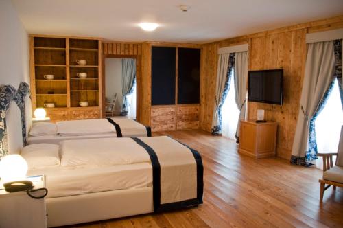 Postel nebo postele na pokoji v ubytování Hotel Bernina 1865 by Kleos Group Collection