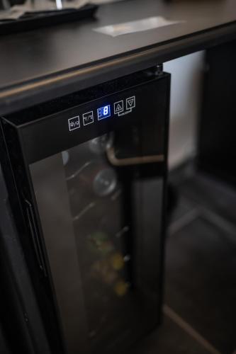 a microwave oven with its door open in a kitchen at Relais Manzoni in Rome