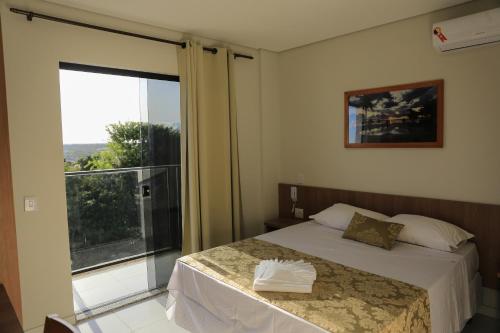 Katil atau katil-katil dalam bilik di Pontal Executive Hotel