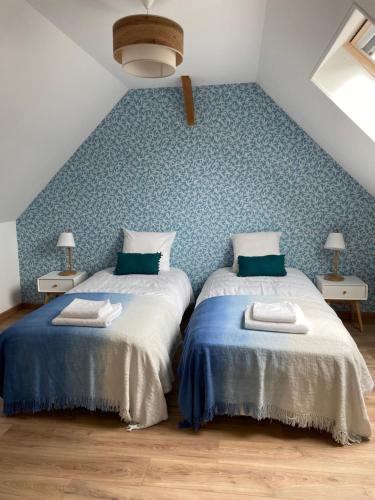 En eller flere senge i et værelse på La Charmeraie : Le Logis