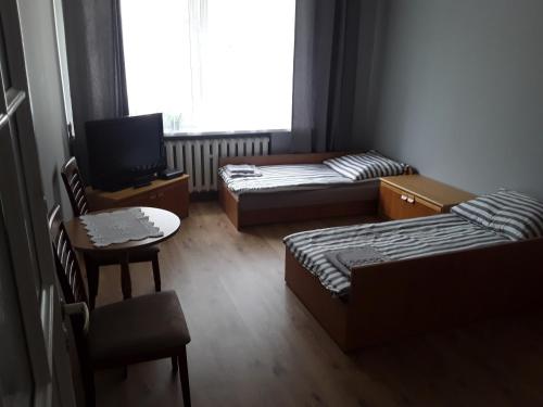 Posteľ alebo postele v izbe v ubytovaní Apartament Nad Bałtykiem