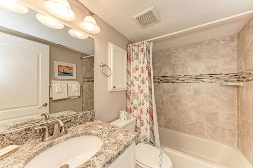 a bathroom with a sink and a tub and a toilet at AMI Dreaming - 4200 Gulf 105 in Holmes Beach