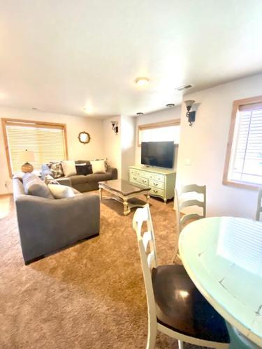 a living room with a couch and a table at The Raspberry Garden in Rexburg