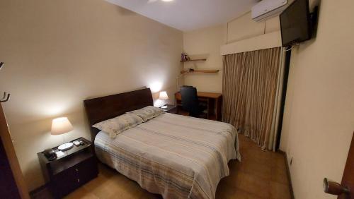 Katil atau katil-katil dalam bilik di Flat na praia da Barra da Tijuca