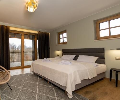 Postel nebo postele na pokoji v ubytování Siedlisko Marianna, apartamenty Janowiec, Kazimierz Dolny