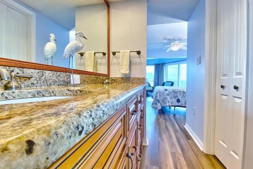 a bathroom with a counter with two birds on it at Water View 506 in Clearwater Beach