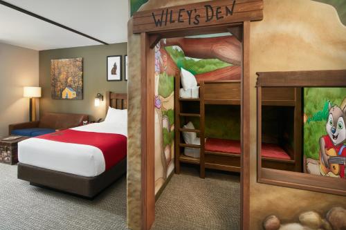 a hotel room with a bedroom with a bunk bed at Great Wolf Lodge Manteca in Manteca