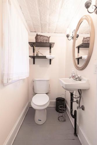 a bathroom with a toilet and a sink at Schilling House in Harpers Ferry