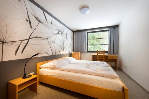 Postel nebo postele na pokoji v ubytování Hotel Bohemia