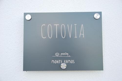 a blue sign on a wall with the words colombo at Monte Ramos in Ferreira do Alentejo