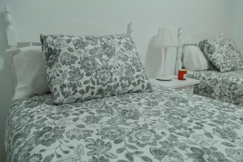 a bed with a pillow sitting on top of it at Casa Ramón Acosta in Breña Baja