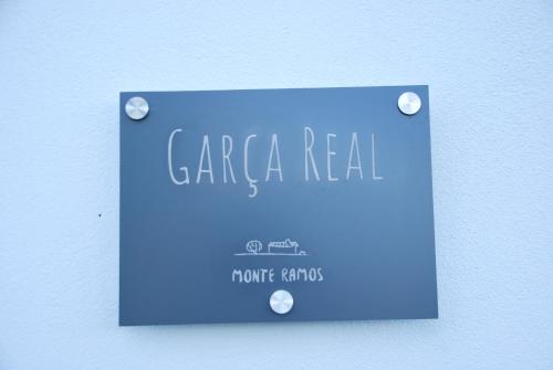 a blue sign that says cara real on a wall at Monte Ramos in Ferreira do Alentejo