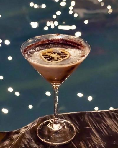 a drink in a martini glass sitting on a table at Hotel Campestre San Joaquin in Garzón