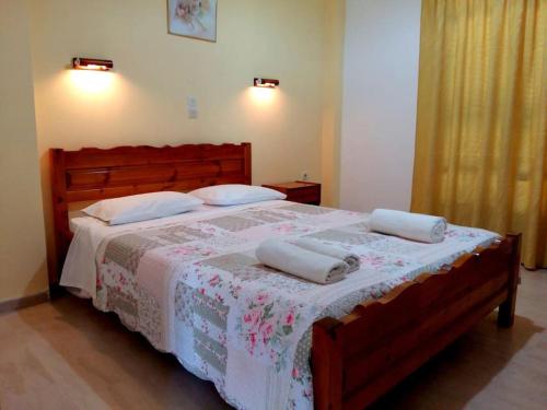 a bedroom with a bed with two pillows on it at Villa Fondas Roda in Roda