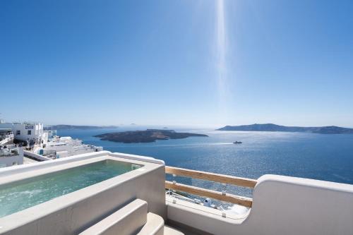 a view of the ocean from the balcony of a cruise ship at Airth Santorini Suites in Firostefani
