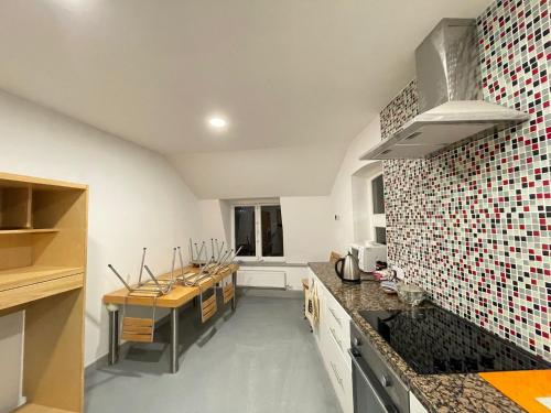 a kitchen with a stove and a counter top at Apartment Chinatown 302 in Newcastle upon Tyne