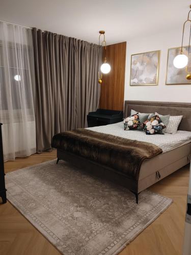 a bedroom with a large bed in a room at Apartament Lipowa 2 in Mrągowo