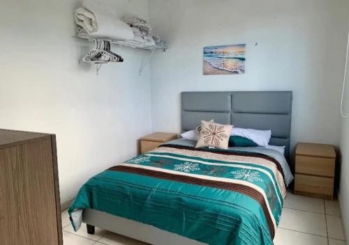 Krevet ili kreveti u jedinici u okviru objekta Alojamiento Vacacional Cerca a la Playa Isla Verde en Carolina
