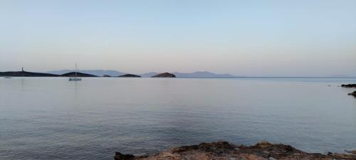 a large body of water with a boat in it at Vivianna's View in Azolimnos