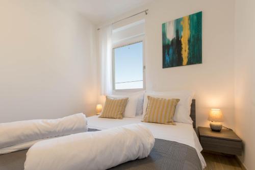 Posteľ alebo postele v izbe v ubytovaní Apartments Moon