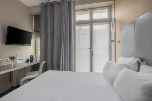Letto o letti in una camera di Grand Hotel Francais - ex Best Western