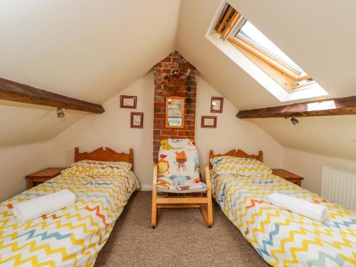 Postel nebo postele na pokoji v ubytování Parkfield Cottage