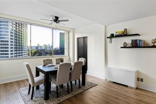 a dining room with a black table and chairs at 1109-Extra LG-King Bed-1 Free Park-Fast WiFi-DTW in Atlanta