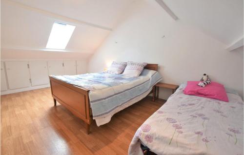 a bedroom with a bed and a dresser in a room at Lovely Home In Marcey-les-grves With Kitchen in Marcey-les-Grèves