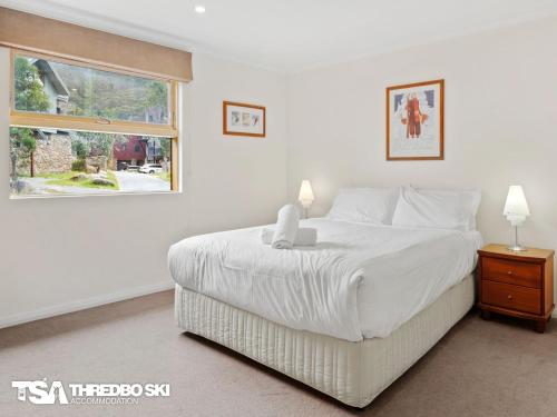 Ένα ή περισσότερα κρεβάτια σε δωμάτιο στο Tomarlin Views 2