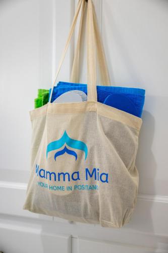 a tote bag with the name namini mita on it at Mamma Mia in Positano