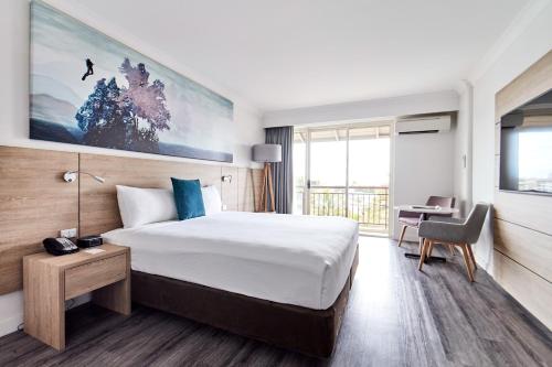 Postel nebo postele na pokoji v ubytování Novotel Cairns Oasis Resort