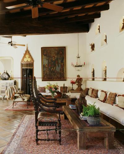 a living room with a couch and a table at Hacienda San Angel in Puerto Vallarta