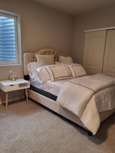 a bedroom with a large bed and a window at Nile Haven in Aurora