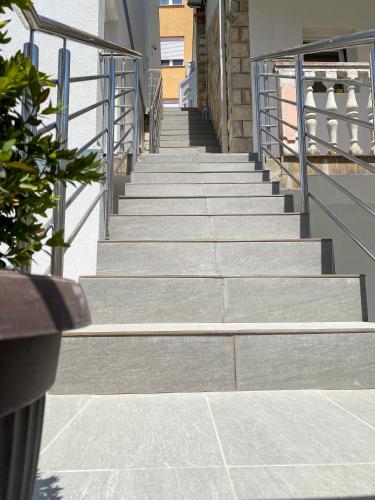 a set of stairs leading up to a building at Apartments Pribilovic in Budva