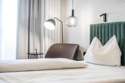 Postel nebo postele na pokoji v ubytování Posthotel Lamm
