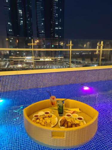 a bowl of food sitting on top of a swimming pool at Hound Hotel Busan Station in Busan