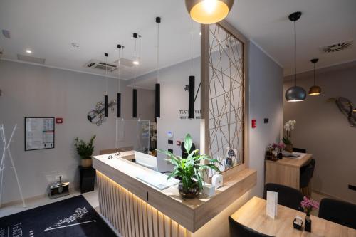 a salon with a counter with plants on it at Teatro Verdi Boutique Hotel in Zadar
