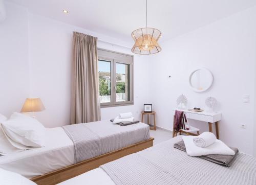 Gulta vai gultas numurā naktsmītnē Ammokrinos Luxury Homes,150m from the beach