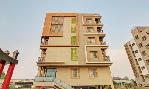 a tall building with balconies on the side of it at Treebo Trend Royal Imperio in Pune